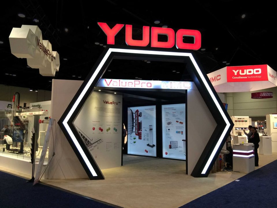 Yudo trade show exhibit honeycomb header designed by BTWN Exhibits.